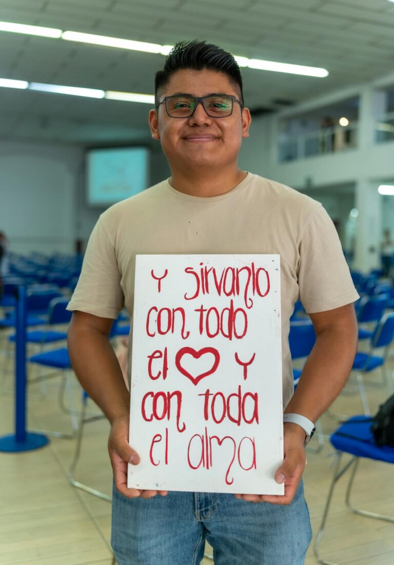 A man holding a sign that says, you can't change the world