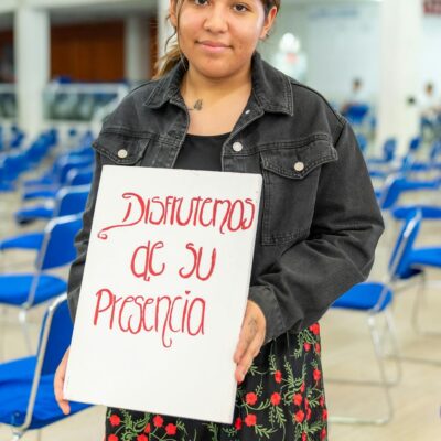 A woman holding a sign that says, don't give up on me